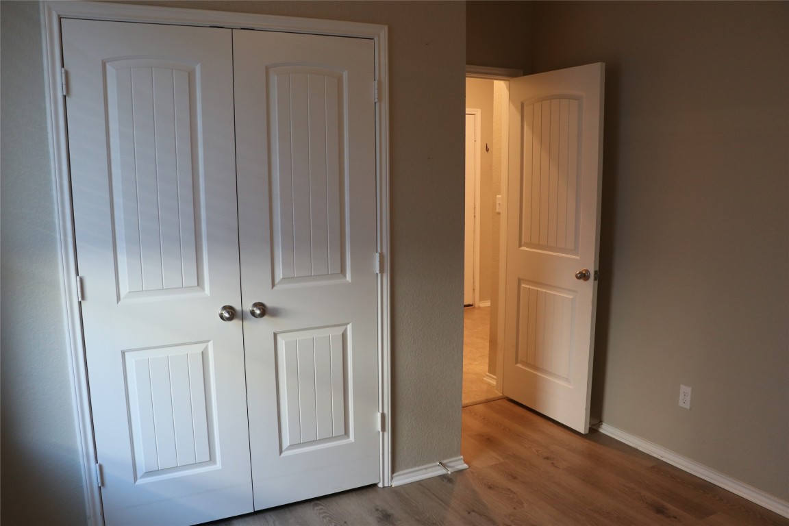 321 Parrot Tulip View Pflugerville, TX 78660 - Photo 8 of 33 a view of empty room with wooden floor