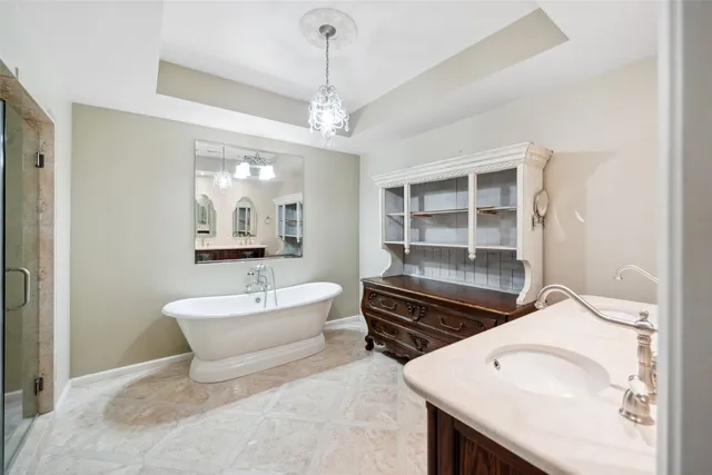 a spacious bathroom with a sink double vanity and a mirror