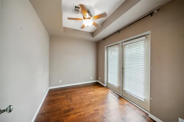 a view of a livingroom with a ceiling fan and window