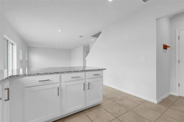 a view of cabinets and window