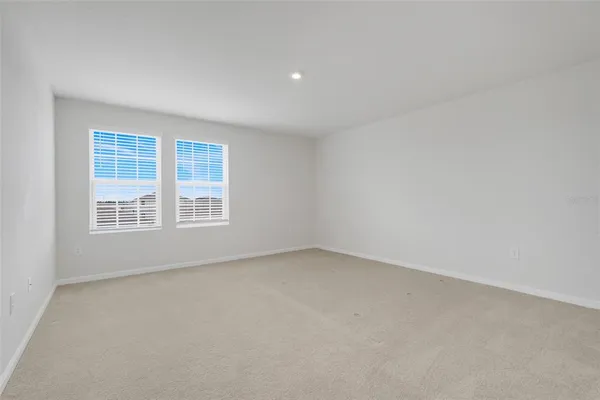 a bathroom with a double vanity sink toilet and a mirror