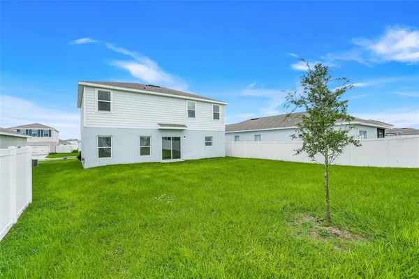 an aerial view of a house with a garden
