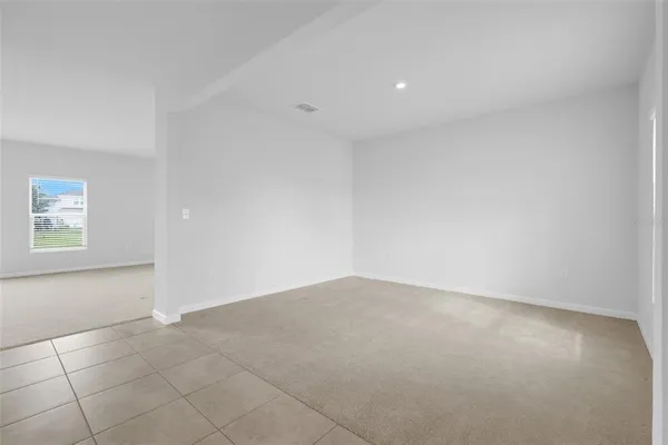 an empty room with a empty space and window