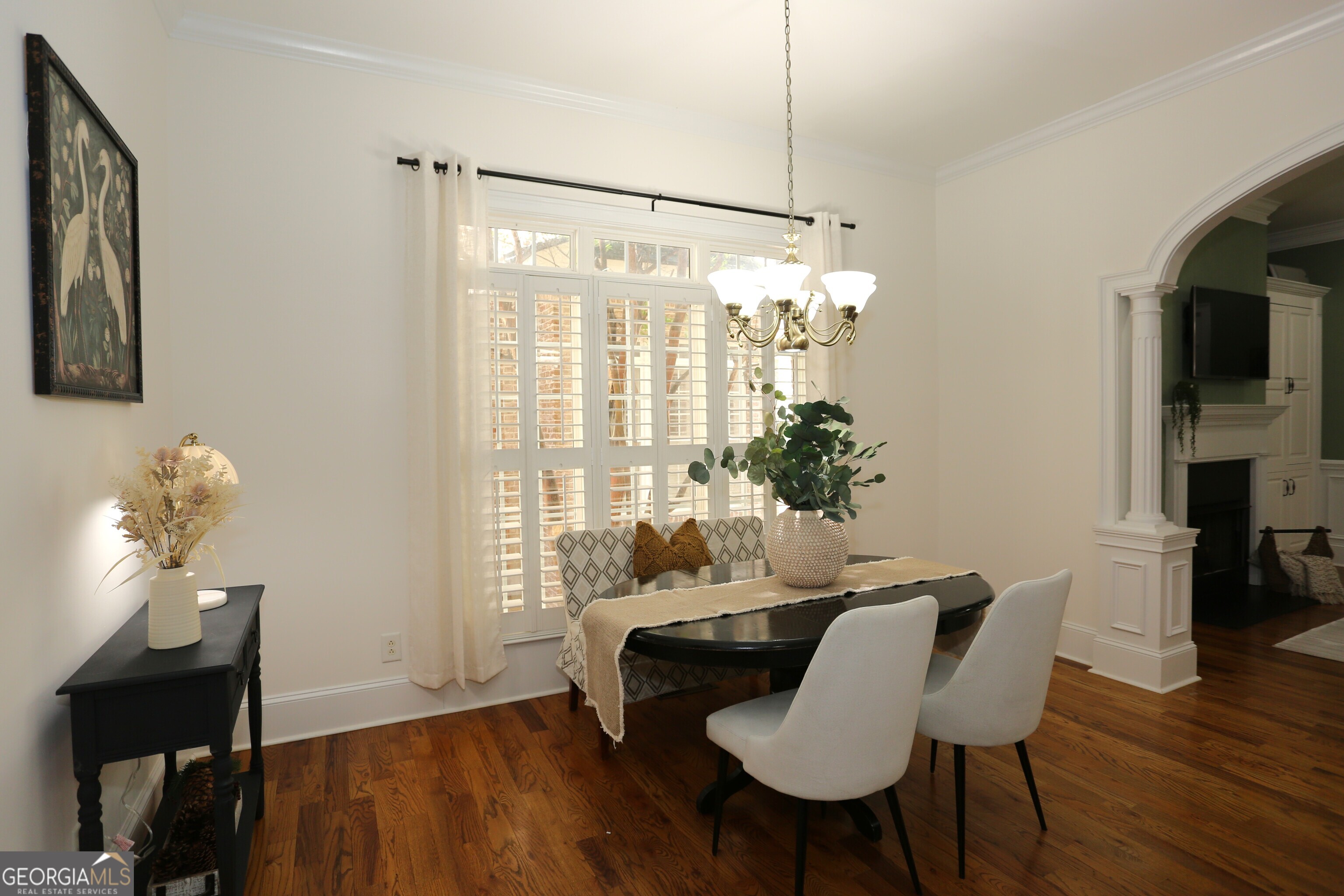 859 Tufthunter Macon, GA 31210 - Photo 21 of 94 a dining room with furniture a chandelier and wooden floor