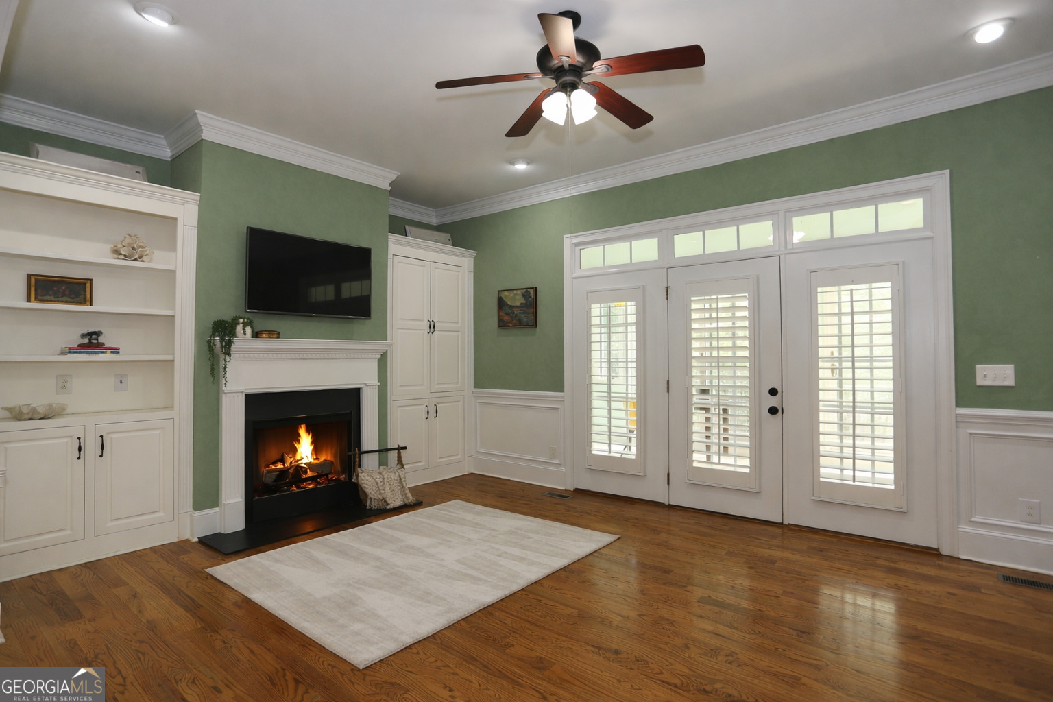 859 Tufthunter Macon, GA 31210 - Photo 24 of 94 a living room with a fireplace a flat screen tv and a fireplace