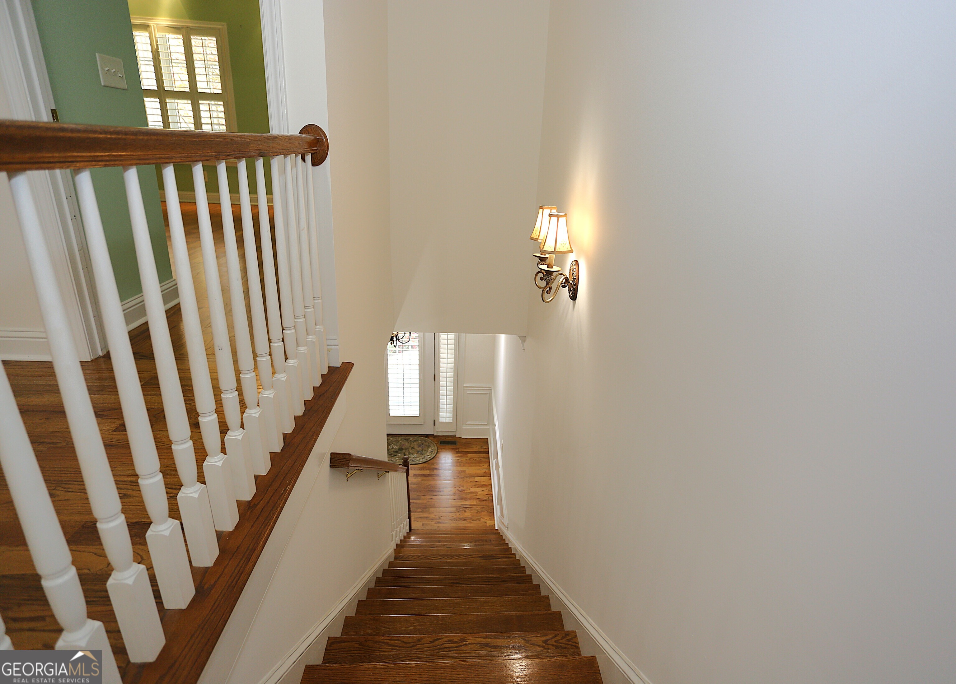 859 Tufthunter Macon, GA 31210 - Photo 69 of 94 a view of a hallway with wooden floor and staircase
