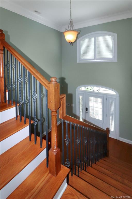 11156 Turtle Bay Court Tega Cay, SC 29708 - Photo 3 of 22 a view of a living room with wooden floor and stairs
