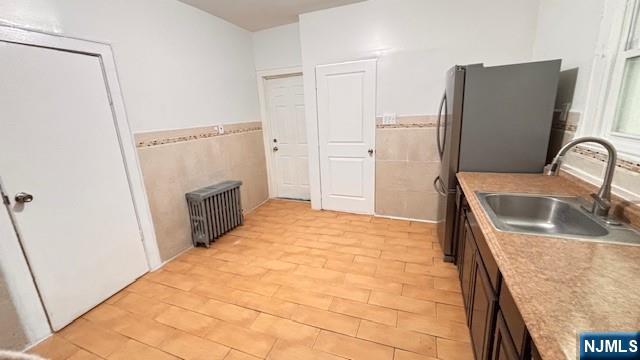 312 Hamilton Street, Unit 1 Harrison, NJ 07029 - Photo 11 of 16 a kitchen with stainless steel appliances granite countertop a refrigerator and a sink
