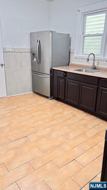 312 Hamilton Street, Unit 1 Harrison, NJ 07029 - Photo 12 of 16 a kitchen with stainless steel appliances kitchen island sink refrigerator and stove