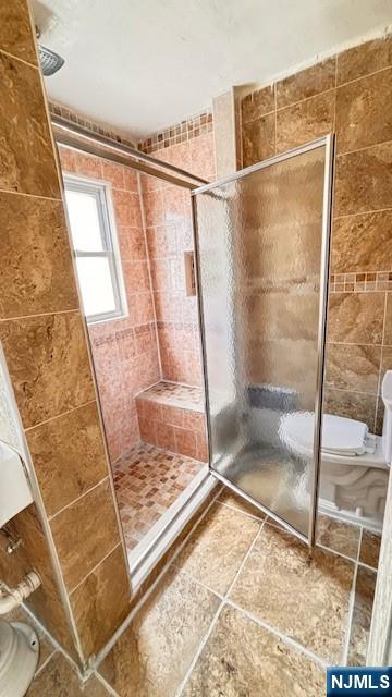 312 Hamilton Street, Unit 1 Harrison, NJ 07029 - Photo 16 of 16 a bathroom with a glass shower door