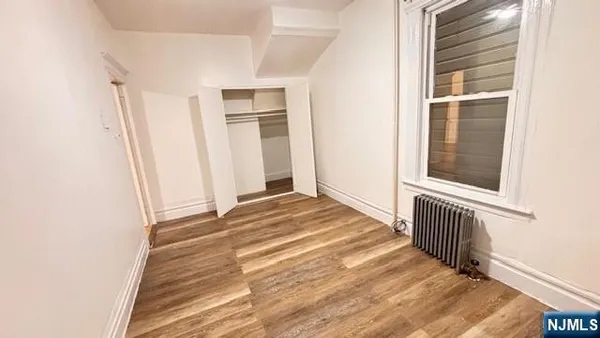 a view of a livingroom with wooden floor