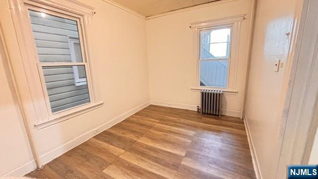 312 Hamilton Street, Unit 1 Harrison, NJ 07029 - Photo 9 of 16 a view of empty room with wooden floor and fan