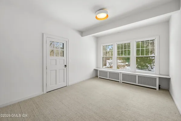 an empty room with windows