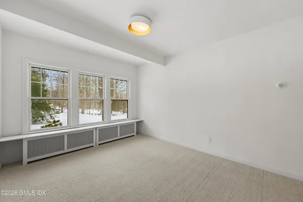 an empty room with windows and view