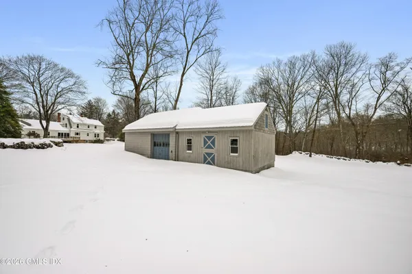 a pathway of a house with a yard