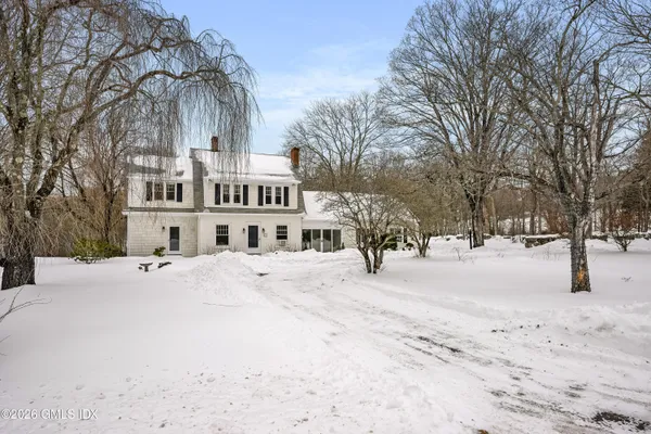 a view of a building with snow in the background