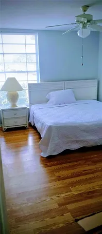 a bedroom with a bed and window