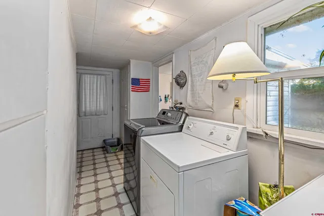 a utility room with a sink a washer and dryer