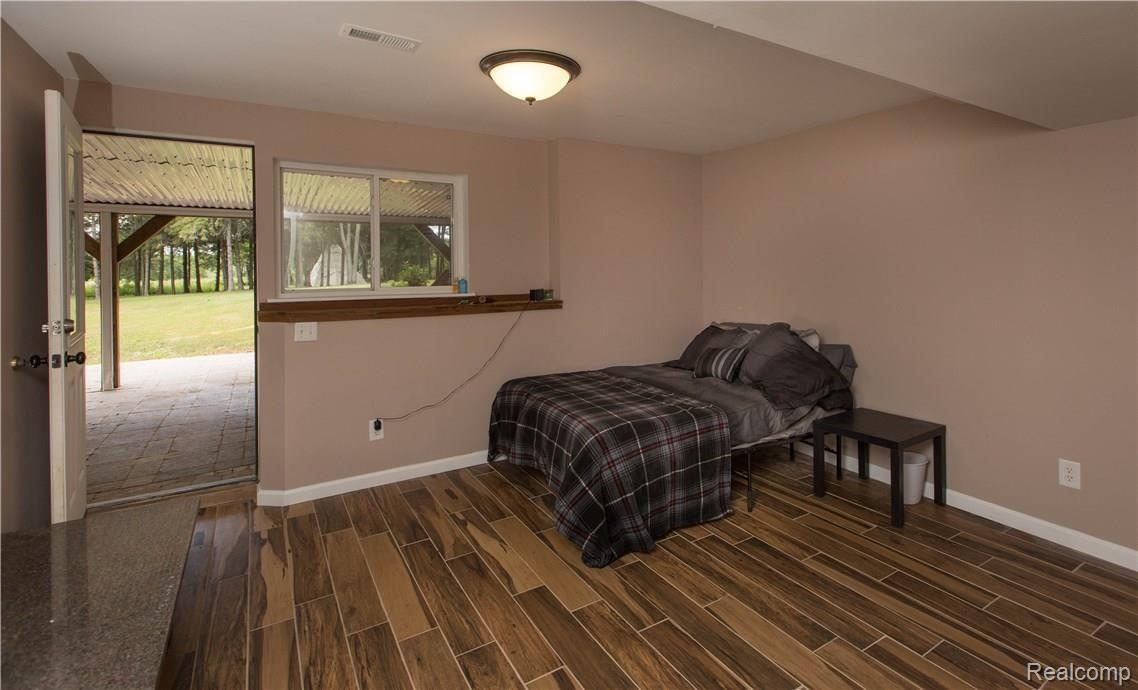 14928 South Fowlerville Road Perry, MI 48872 - Photo 18 of 27 14928 S Fowlerville Rd-Perry-basement bedroom.jpg