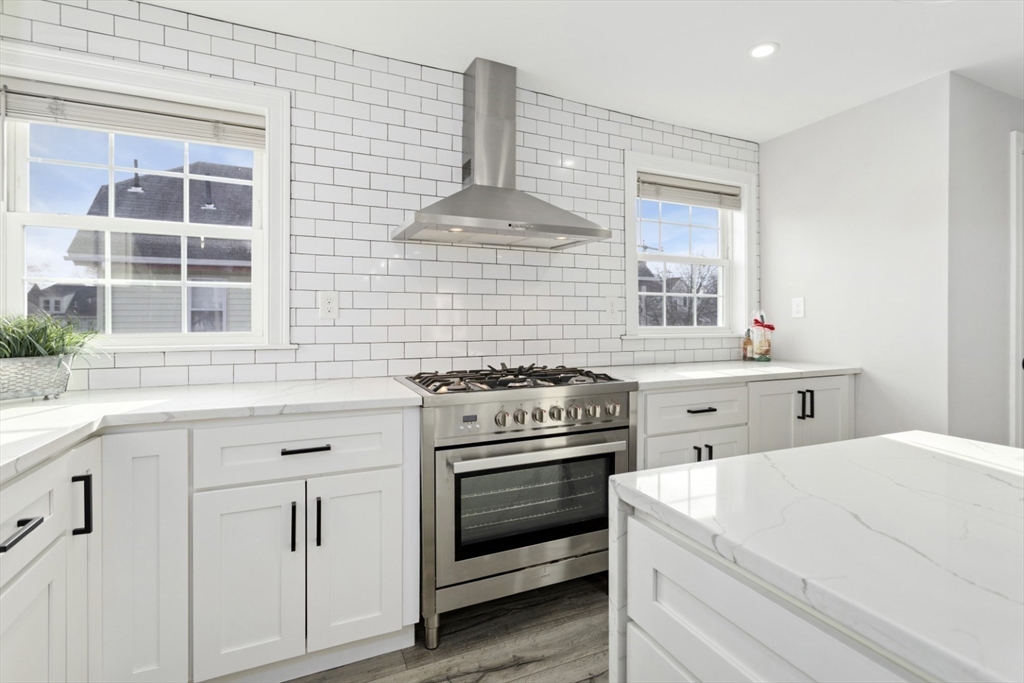 87 Otis Street, Unit 2 Medford, MA 02155 - Photo 12 of 42 a kitchen with a stove and a sink