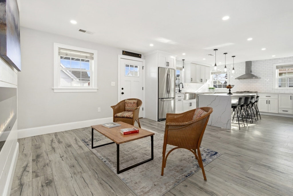 87 Otis Street, Unit 2 Medford, MA 02155 - Photo 13 of 42 a living room with furniture and wooden floor