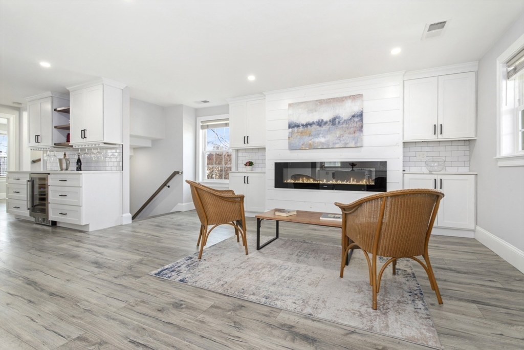 87 Otis Street, Unit 2 Medford, MA 02155 - Photo 15 of 42 a living room with furniture and a fireplace