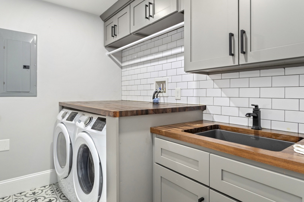 87 Otis Street, Unit 2 Medford, MA 02155 - Photo 29 of 42 a kitchen that has a sink and a stove