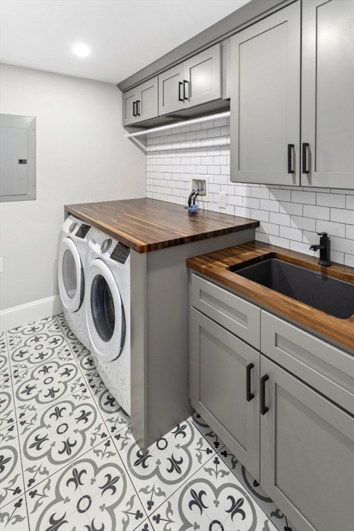 87 Otis Street, Unit 2 Medford, MA 02155 - Photo 30 of 42 a utility room with sink dryer and washer