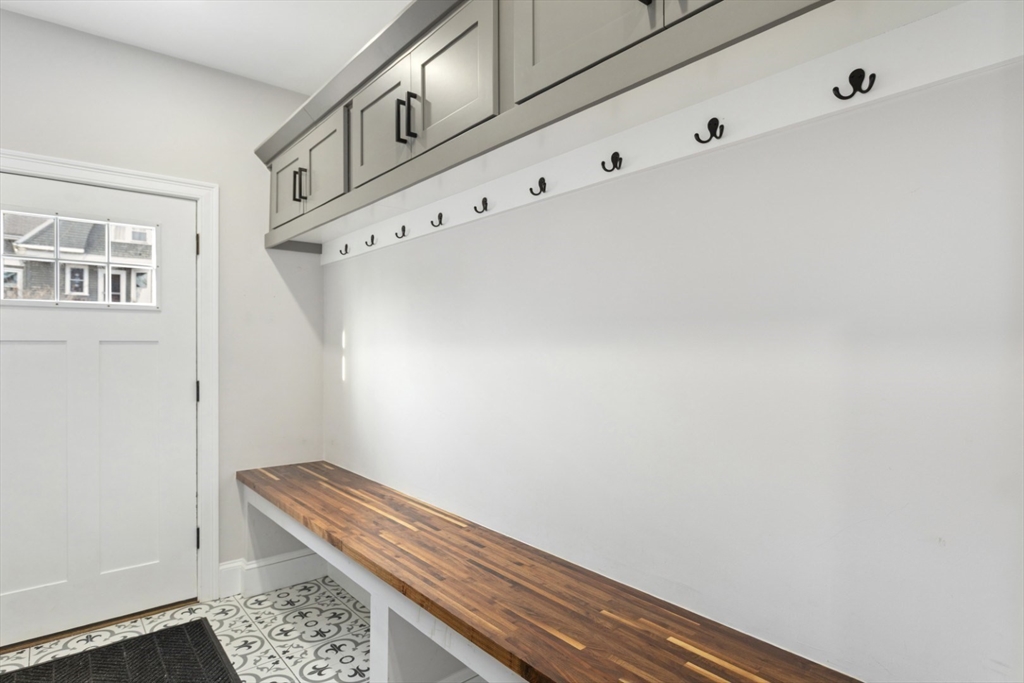 87 Otis Street, Unit 2 Medford, MA 02155 - Photo 4 of 42 a view of room with window and hallway