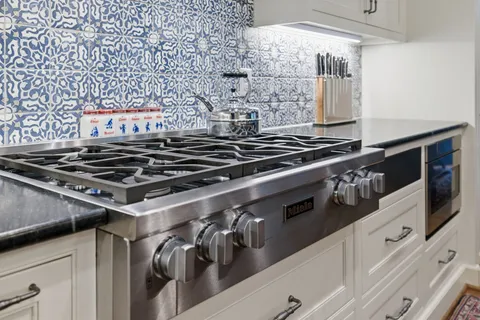 a spacious bathroom with a granite countertop sink a mirror and a
