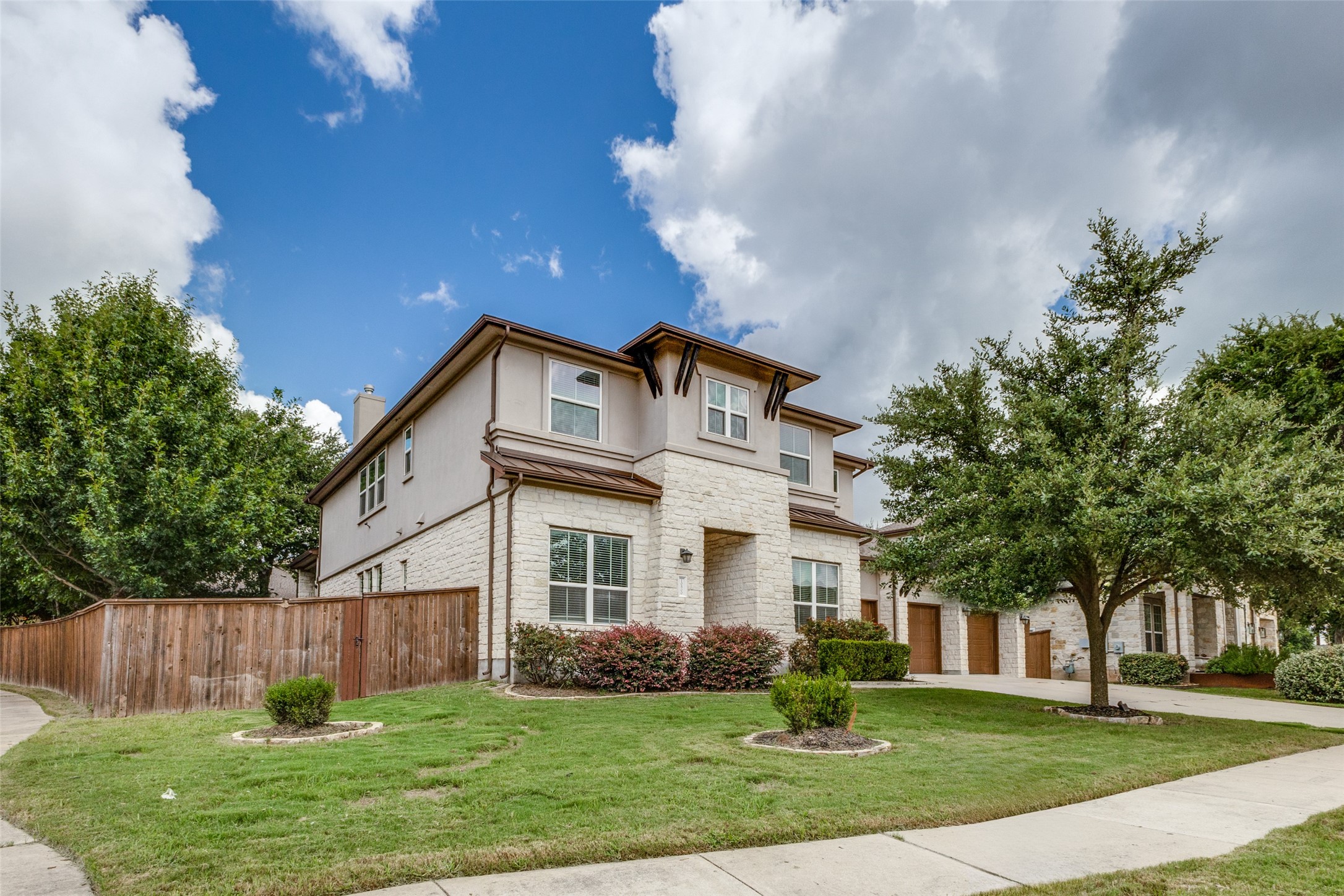 10800 Canton Jack Road Austin, TX 78717 - Photo 1 of 1 This home's front elevation is a masterpiece of design, featuring a harmonious blend of Austin stone and stucco details that exude elegance and sophistication. The copper standing seam roof adds a touch of luxury, complemented by the durable and attractive composition shingles. Every detail has been thoughtfully crafted to create a striking and inviting curb appeal. This residence stands as a testament to quality and timeless beauty, making it a true standout in the neighborhood.