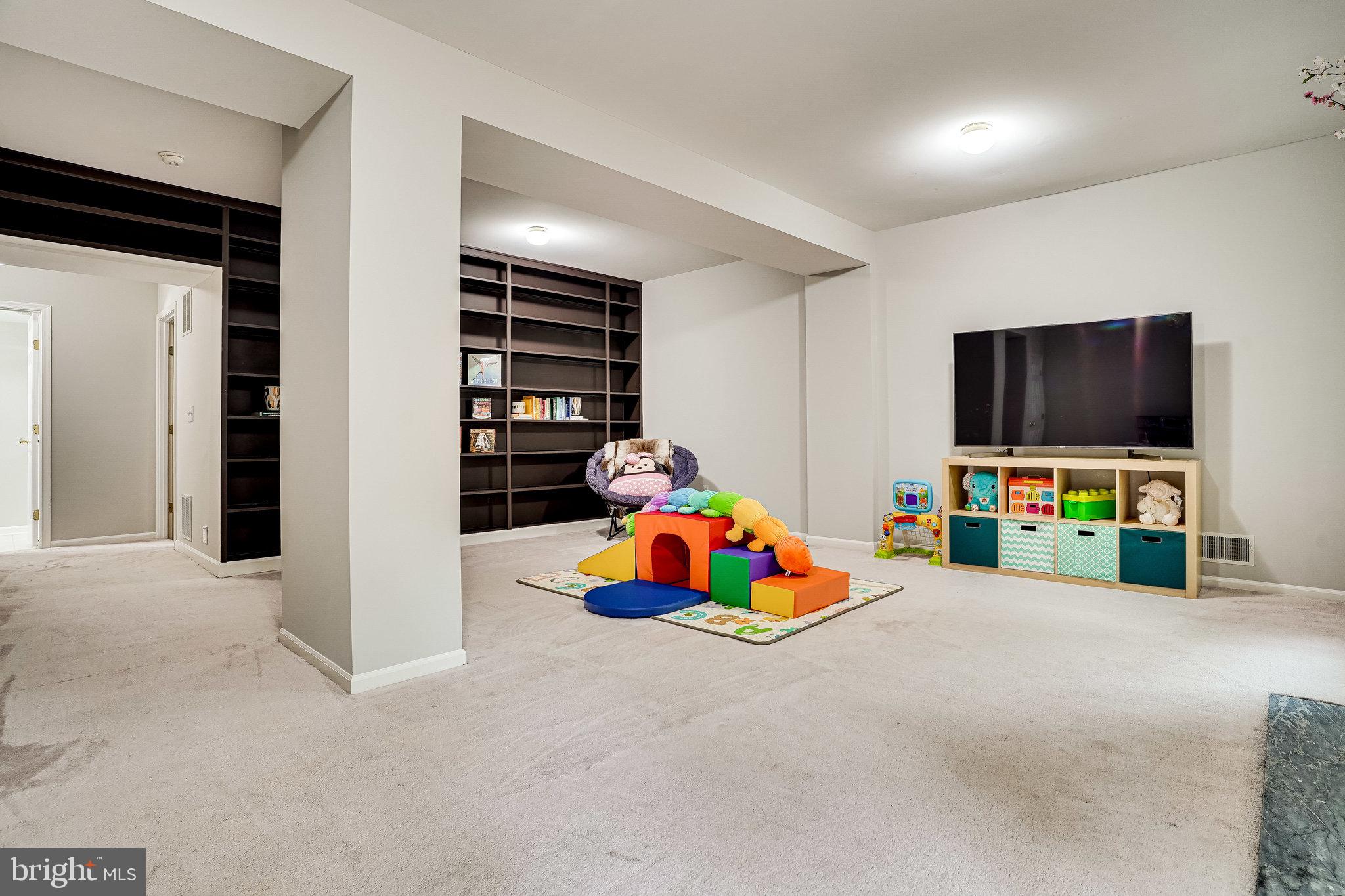6515 Milva Lane Springfield, VA 22150 - Photo 34 of 40 Ginormous rec room with built-in shelving