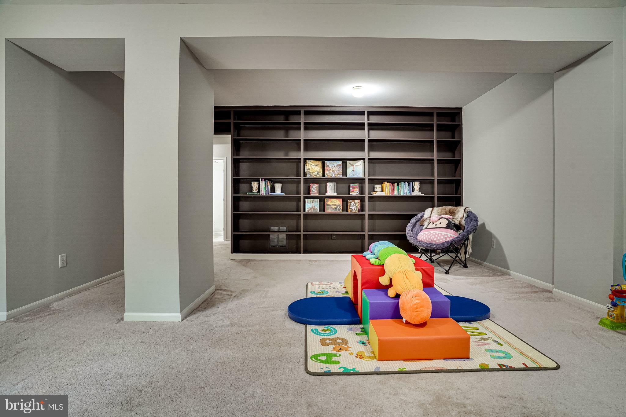 6515 Milva Lane Springfield, VA 22150 - Photo 35 of 40 Ginormous rec room with built-in shelving