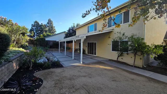a house view with a garden space