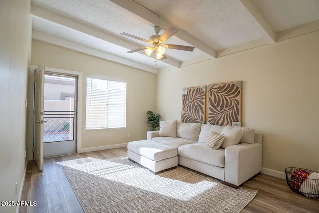 a living room with furniture and a rug