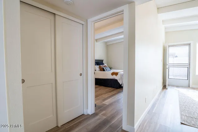 a view of a bedroom from a hallway