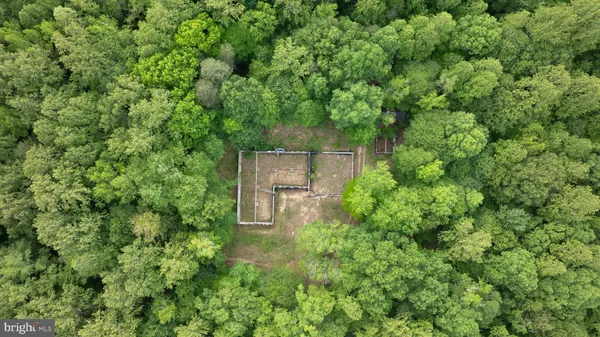 a aerial view of a house with a yard