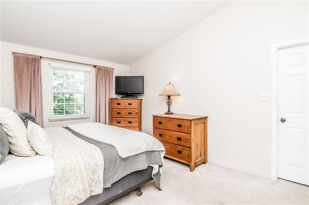 104 Bertley Ridge Drive Coraopolis, PA 15108 - Photo 12 of 25 a bedroom with a bed and tv on dresser