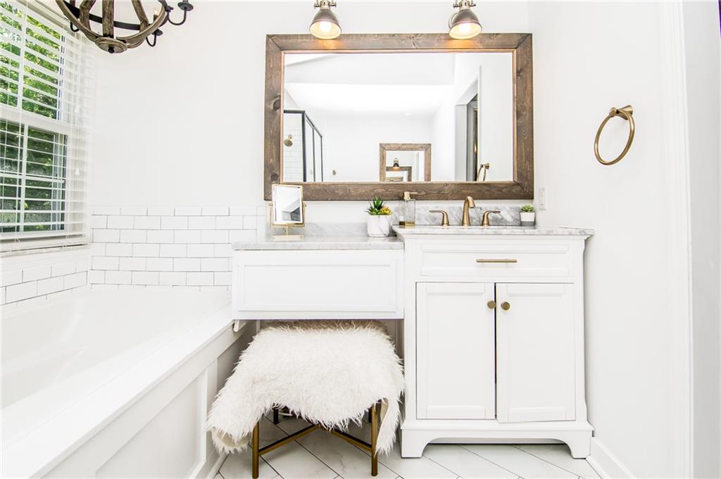 104 Bertley Ridge Drive Coraopolis, PA 15108 - Photo 14 of 25 a en suite bathroom with a granite countertop sink and a mirror
