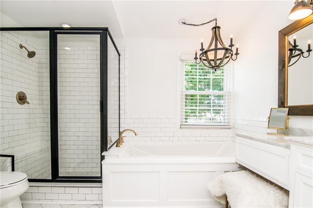 104 Bertley Ridge Drive Coraopolis, PA 15108 - Photo 15 of 25 a bathroom with a granite countertop sink a toilet and shower