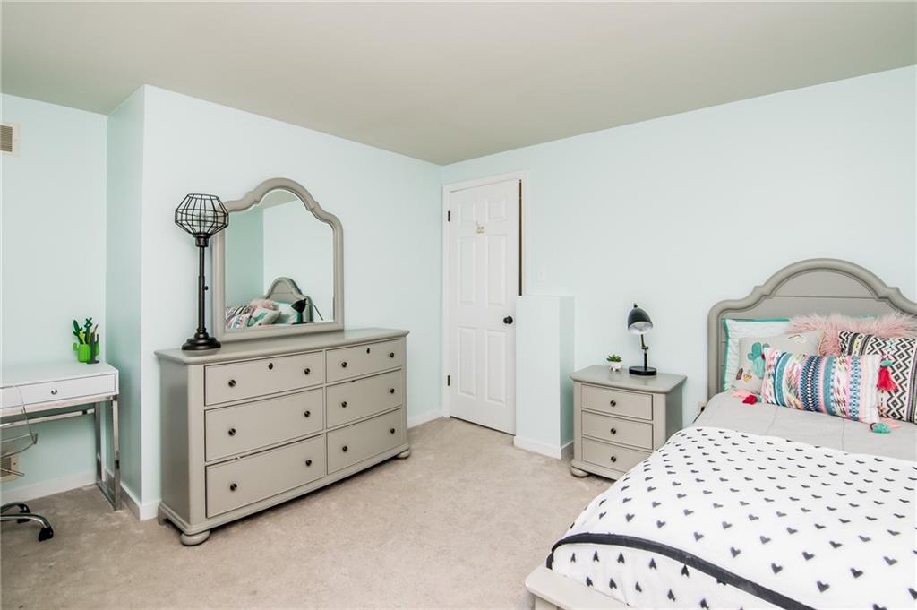 104 Bertley Ridge Drive Coraopolis, PA 15108 - Photo 17 of 25 a bedroom with a bed and a dresser