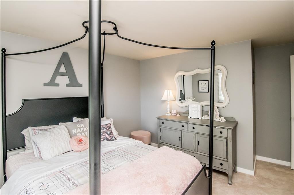 104 Bertley Ridge Drive Coraopolis, PA 15108 - Photo 18 of 25 a bedroom with a bed a mirror and desk