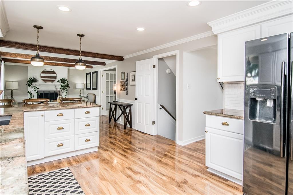 104 Bertley Ridge Drive Coraopolis, PA 15108 - Photo 3 of 25 a kitchen with a refrigerator and a stove