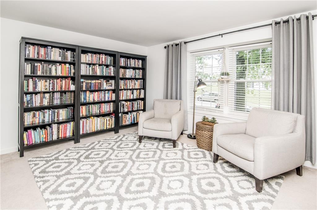104 Bertley Ridge Drive Coraopolis, PA 15108 - Photo 7 of 25 a living room with furniture and a book shelf