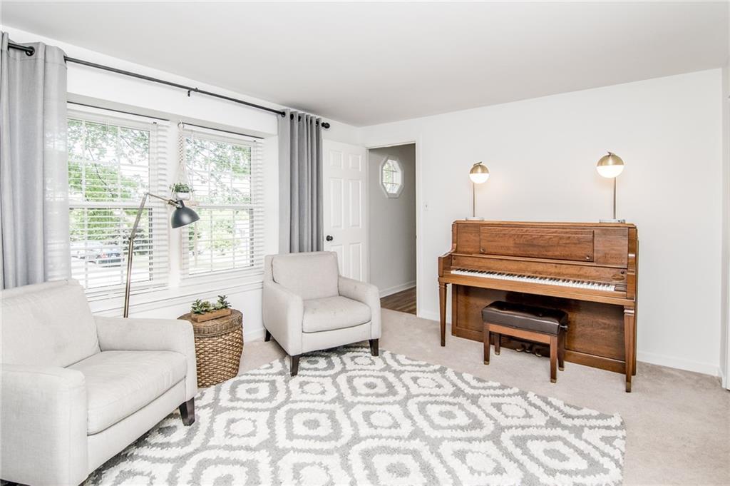 104 Bertley Ridge Drive Coraopolis, PA 15108 - Photo 8 of 25 a living room with furniture a rug and a large window