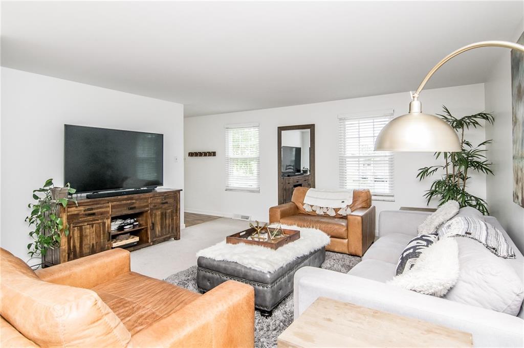 104 Bertley Ridge Drive Coraopolis, PA 15108 - Photo 10 of 25 a living room with furniture and a flat screen tv