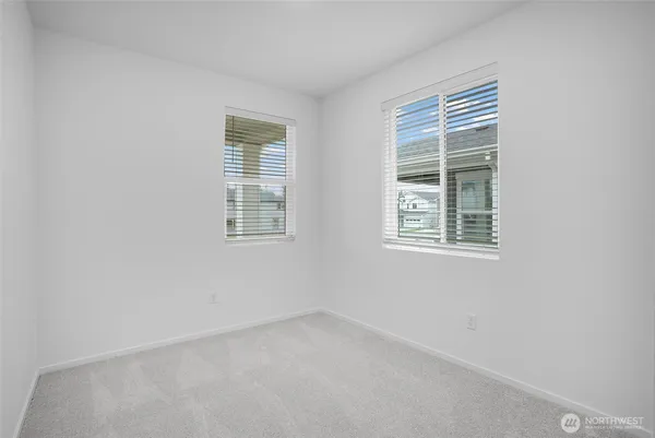 a view of a small space with wooden floor