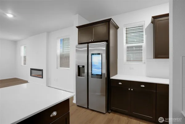 a kitchen with a sink and a refrigerator