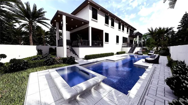 a view of a house with pool and sitting area
