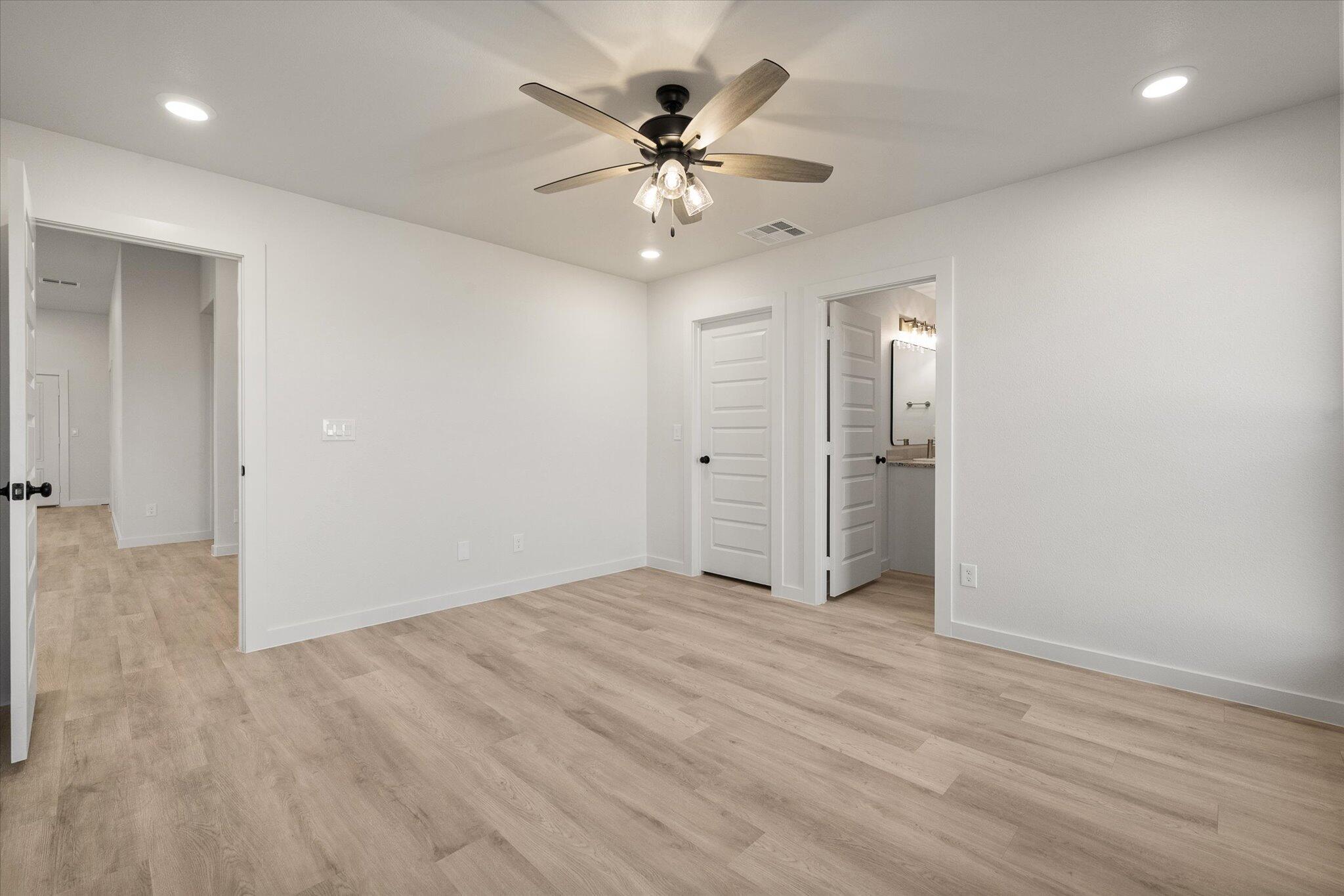 3022 138th Place Lubbock, TX 79423 - Photo 14 of 20 an empty room with fan and a ceiling fan